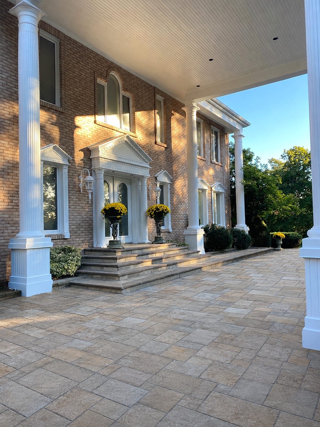 Luxury estate paver entrance at golden hour